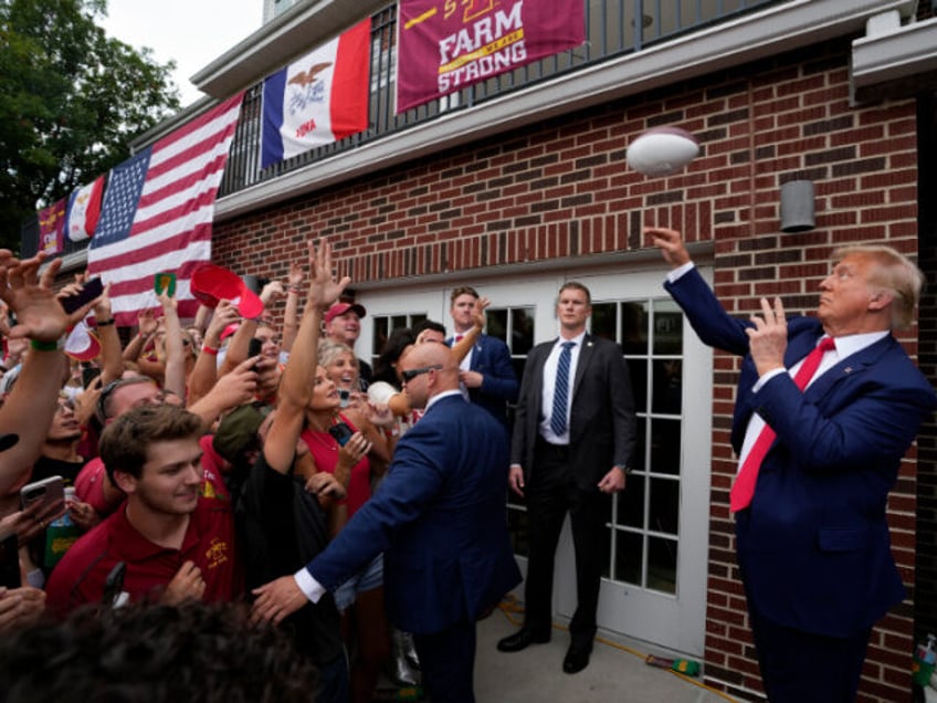 trump rocks iowa iowa state game parties with frat flips burgers throws footballs