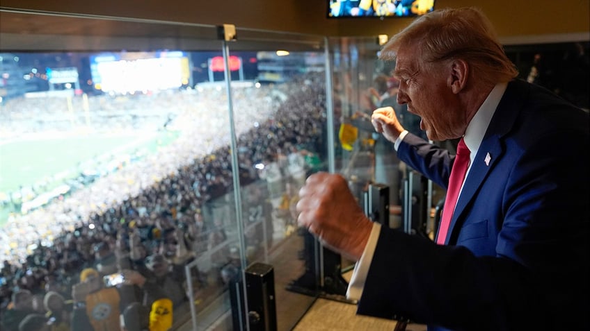 Donald Trump attends a game between the NFL Pittsburgh Steelers and the New York Jets