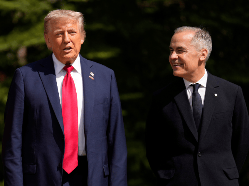 Canada's Prime Minister Mark Carney, right, greets President Donald Trump during the offic