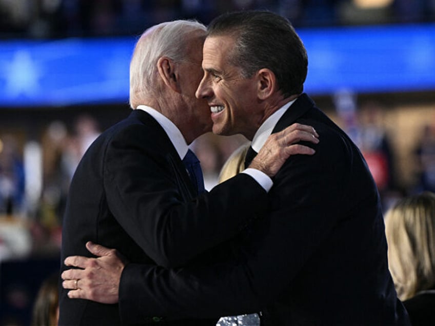 US President Joe Biden and his son Hunter Biden hug on stage at the conclusion of the firs