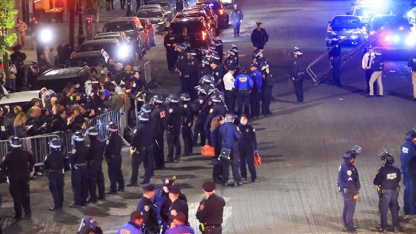 police lined up against protests at Columbia University at night