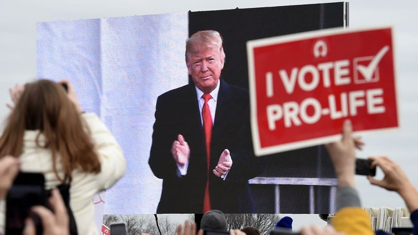 Trump and a pro life sign