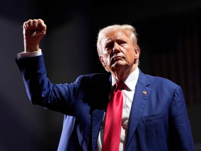 Republican presidential nominee former President Donald Trump gestures after speaking at a