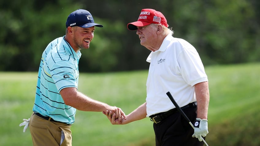 Bryson DeChambeau and Donald Trump shake hands