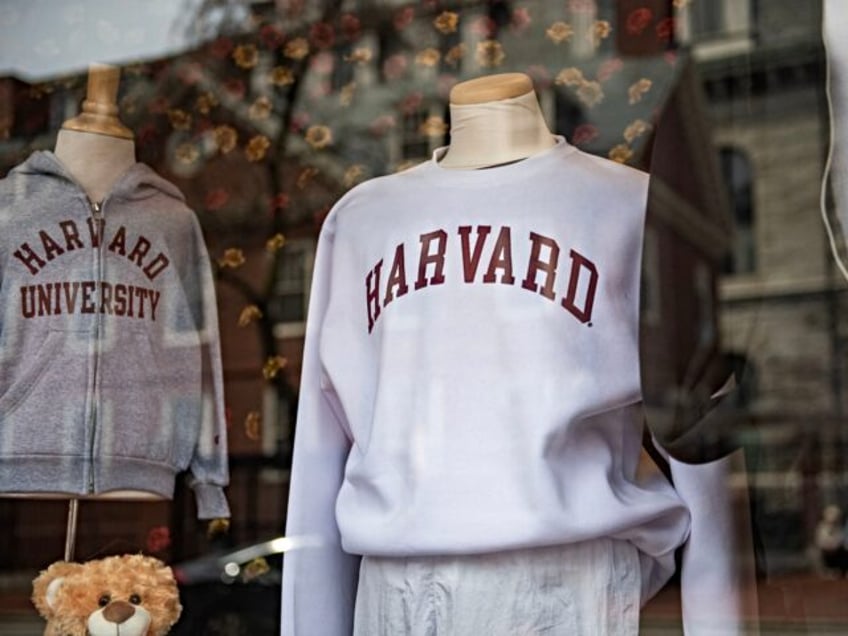 Harvard sweatshirts are displayed for sale in a school store window on the Harvard Univers