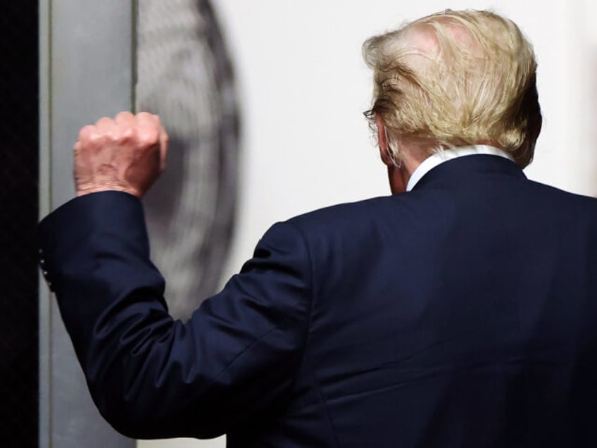 NEW YORK, NEW YORK - MAY 29: Former U.S. President Donald Trump raises his fist as he depa