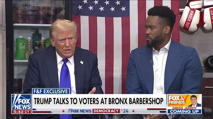 Trump seated beside Lawrence Jones in barbershop