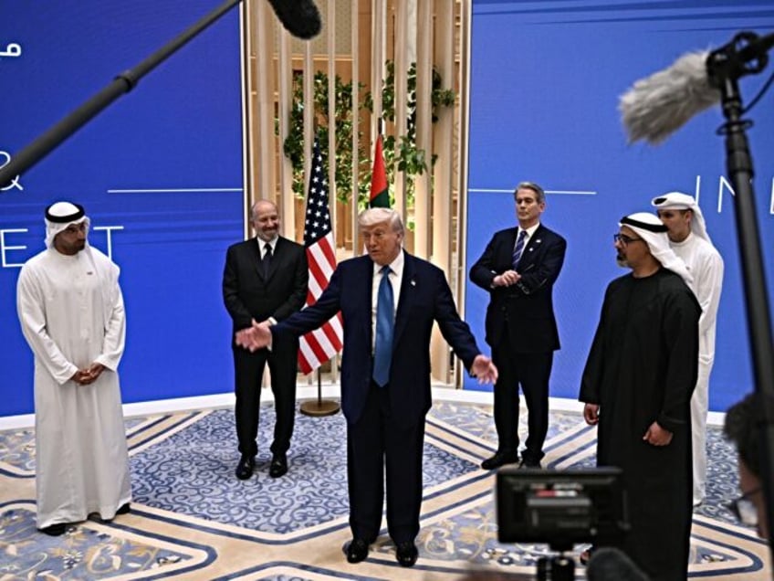 US President Donald Trump (C) speaks as and US Secretary of Commerce Howard Lutnick (2nd-L
