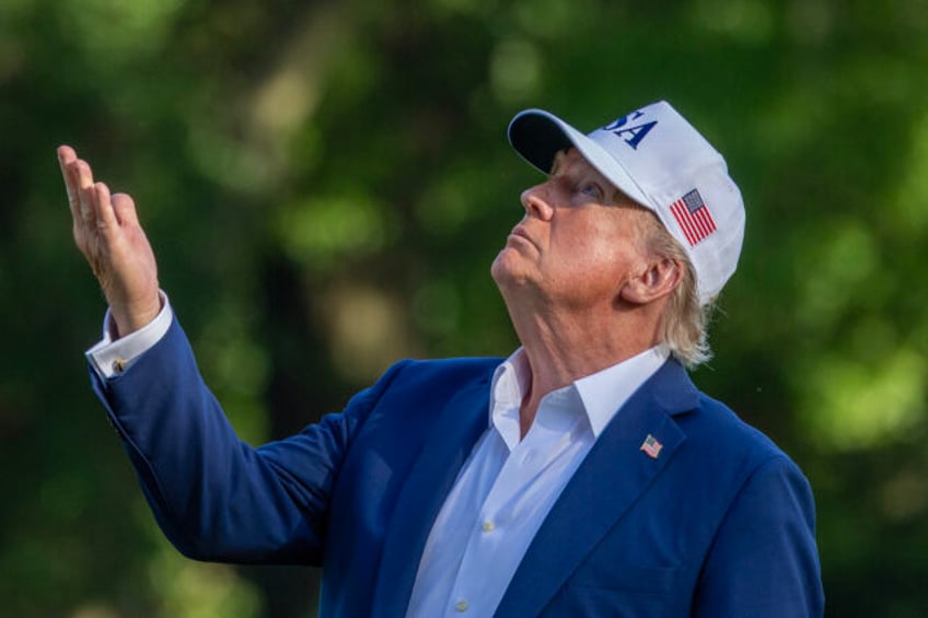 WASHINGTON, DC - JULY 06: U.S. President Donald Trump looks up at the new flag on the sout