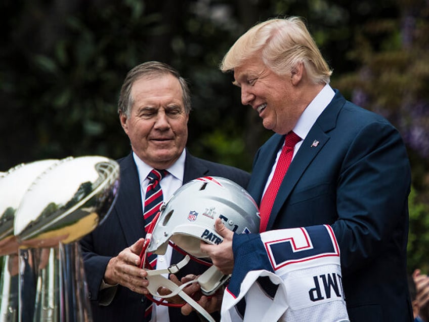 WASHINGTON, DC - APRIL 19: President Donald Trump is presented a New England Patriots helm