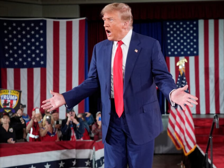 Republican presidential candidate former President Donald Trump arrives to speak at a camp