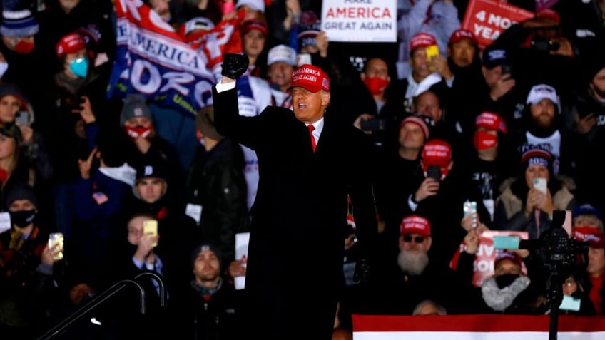 US President Donald Trump gestures at the end of his final Make America Great Again rally of the 2020 US Presidential campaign at Gerald R. Ford International Airport on November 2, 2020, in Grand Rapids, Michigan. (Photo by JEFF KOWALSKY / AFP) (Photo by JEFF KOWALSKY/AFP via Getty Images)