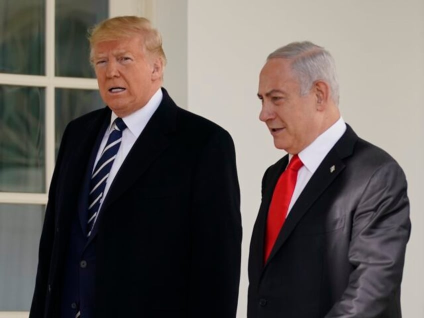 President Donald Trump and Israeli Prime Minister Benjamin Netanyahu walk to a meeting in