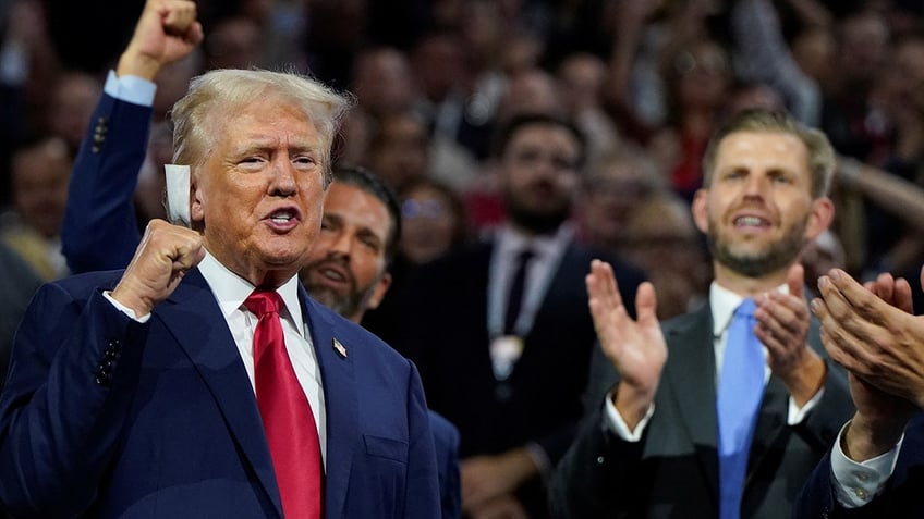 Donald Trump raises his fist during Day 1 of the Republican National Convention