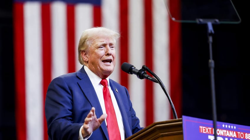 Donald Trump speaks at podium