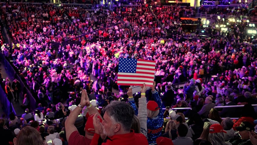 Attendees cheer before President-elect Donald Trump arrives at a rally ahead of the 60th Presidential Inauguration