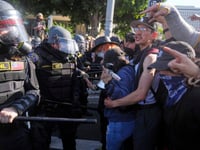 Trump vows to ‘HIT’ any protester who spits on police. He pardoned those who did far worse on Jan. 6
