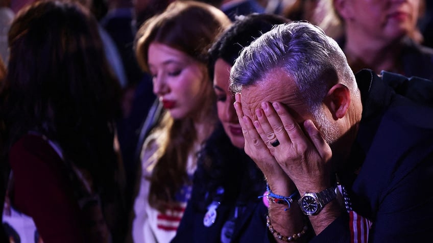 Harris supporter with head in hands