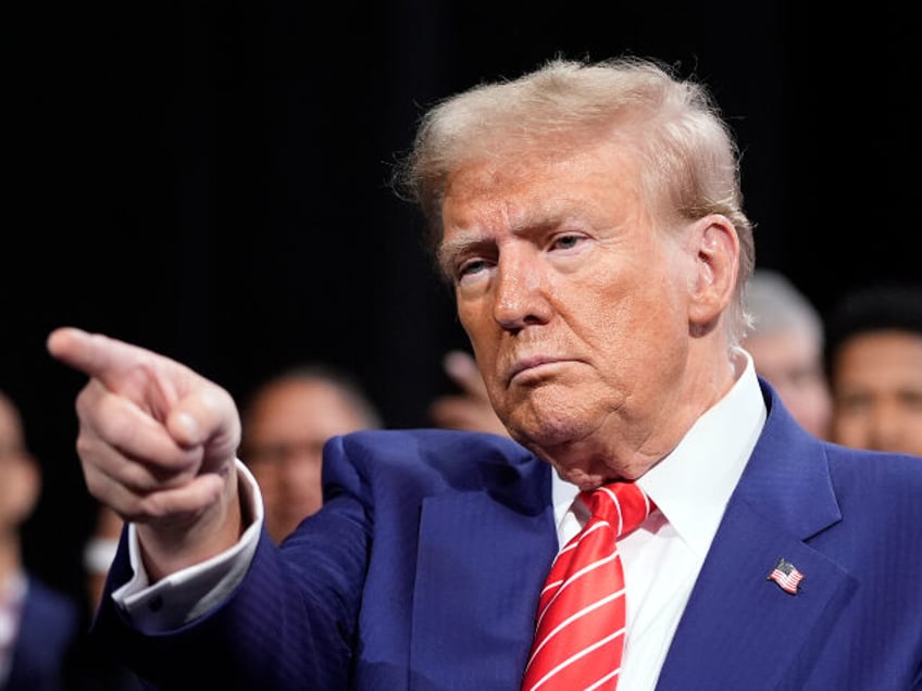 Republican presidential nominee former President Donald Trump gestures at a campaign event