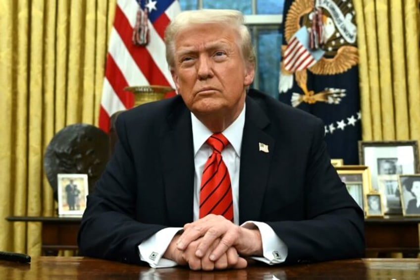 US President Donald Trump speaks to the press after signing an executive order in the Oval