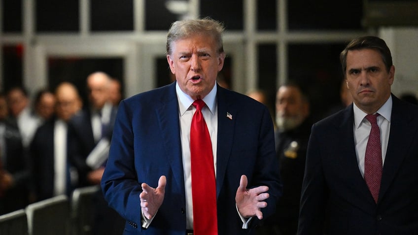 Former US President Donald Trump speaks to members of the media at Manhattan criminal court