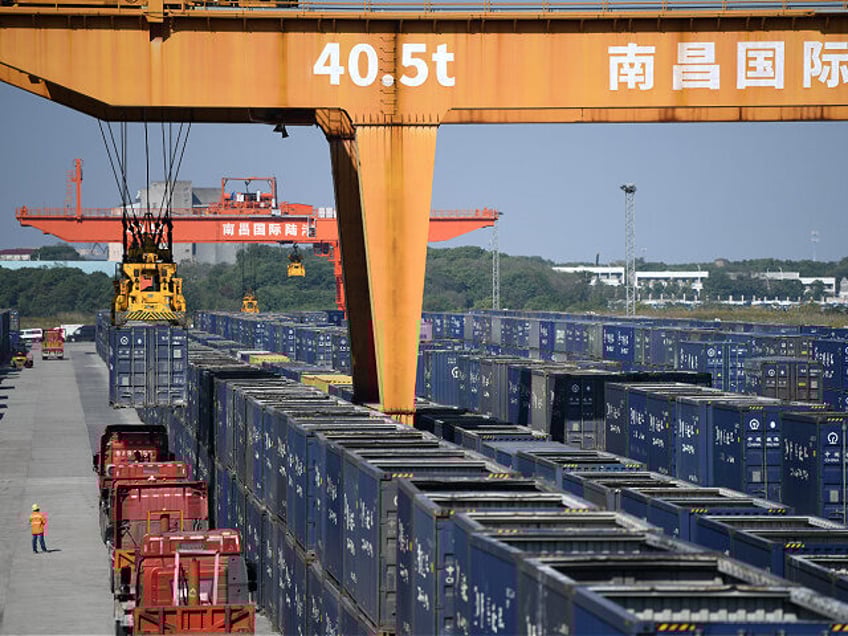 A gantry crane lifts containers at the Nanchang International Dry Port in Nanchang, Jiangs