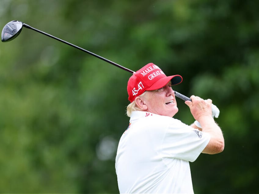BEDMINSTER, NEW JERSEY - AUGUST 10: Former President Donald Trump follows his tee shot dur