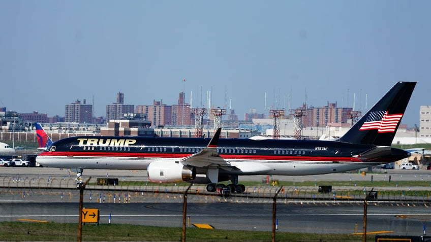 Former President Donald Trump's plane taxis on the runway at LaGuardia Airport