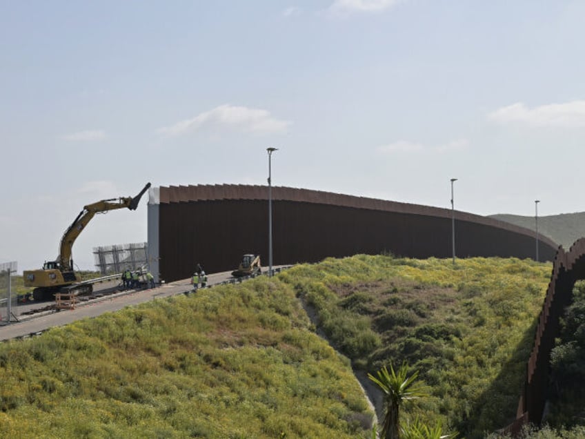 The first 30-foot fence panels are being installed along the U.S.-Mexico border that goes