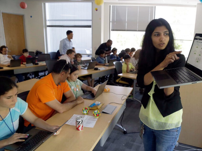 Product manager Vidya Nagarajan demonstrates the new Chrome notebook during a workshop for