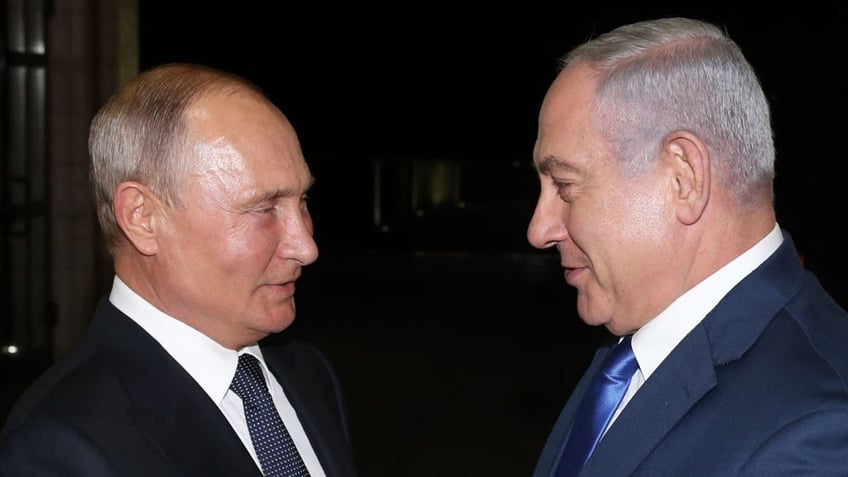 Russian President Vladimir Putin, left, greets Israeli Prime Minister Benjamin Netanyahu during their meeting at the Bocharov Ruchey State Residence on Sept. 12, 2019 in Sochi, Russia.