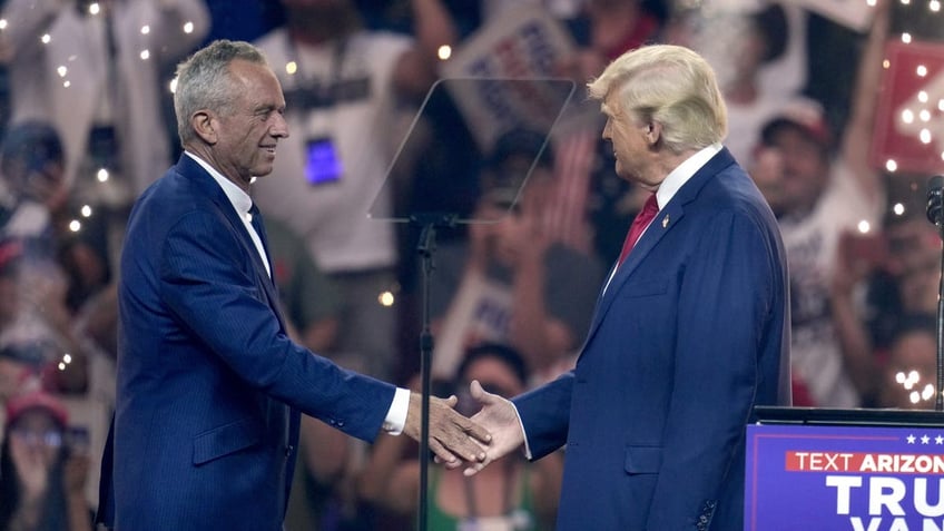 Trump shaking hands with RFK, Jr