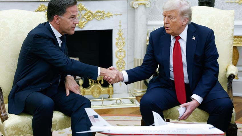 Donald Trump greets NATO Secretary General Mark Rutte (L) in the Oval Office at the White House on July 14, 2025 in Washington, DC. 