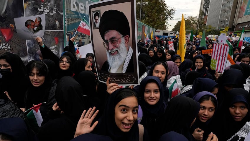 Iranian supporters of Supreme Leader Ayatollah Ali Khamenei