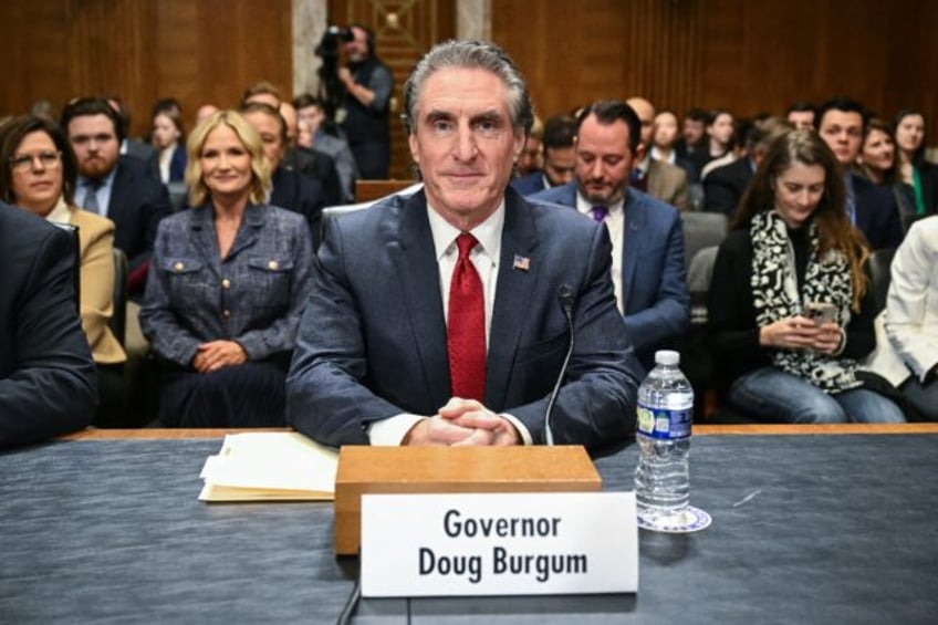 Former North Dakota Governor Doug Burgum takes his seat as he arrives for a Senate Energy