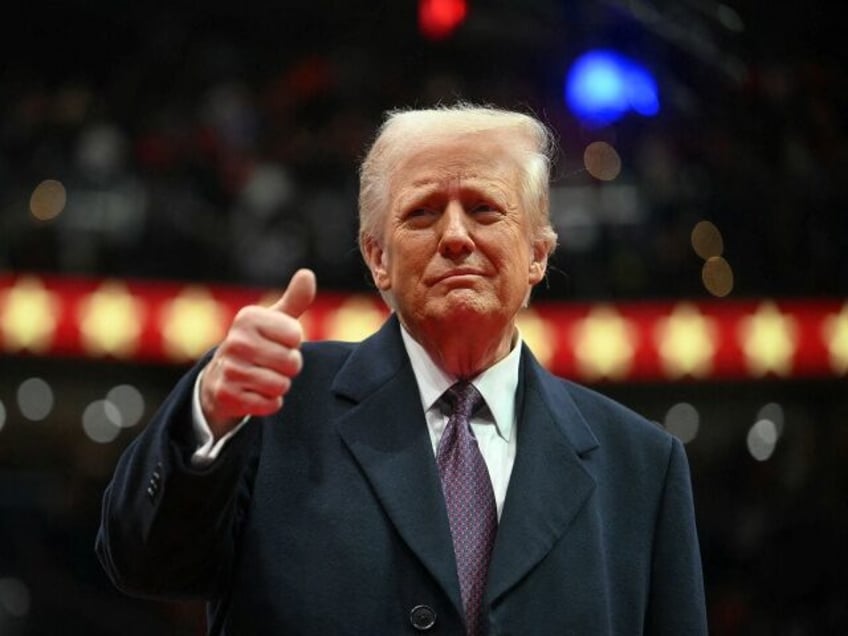 US President Donald Trump give the thumbs up during the inaugural parade inside Capitol On