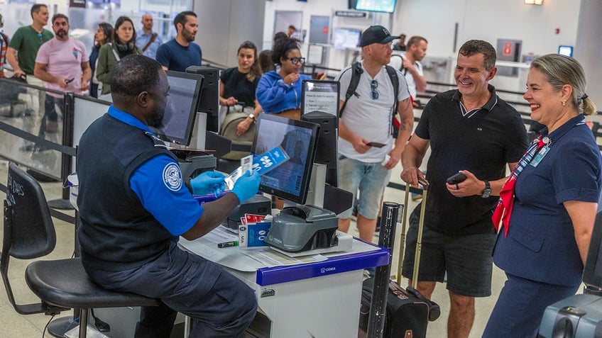Passengers in TSA line in Miami