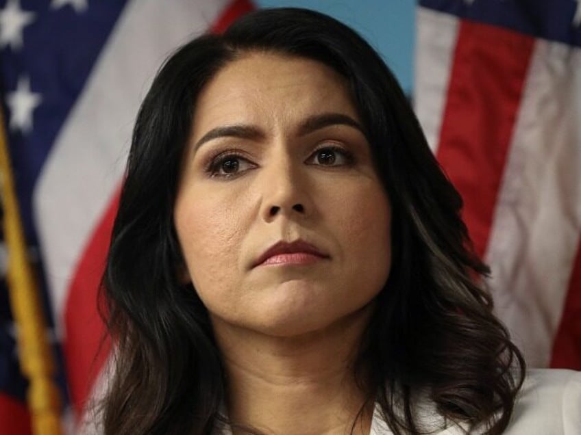 tulsi gabbard blasts disqualified dojs trump indictment biden willing to destroy opponent to protect dem elite