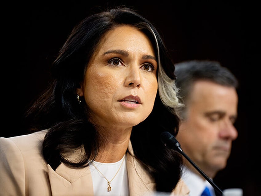 Director of National Intelligence Tulsi Gabbard (L) accompanied by Central Intelligence Ag