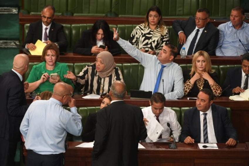 Tunisian lawmakers discuss the draft electoral reform that would strip a court from some o