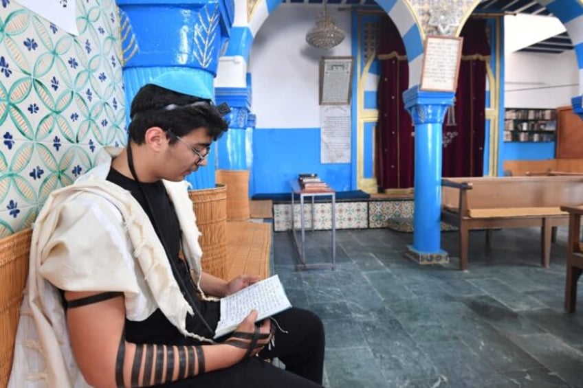 A Tunisian man prays at a synagogue in Djerba during an annual Jewish pilgrimage