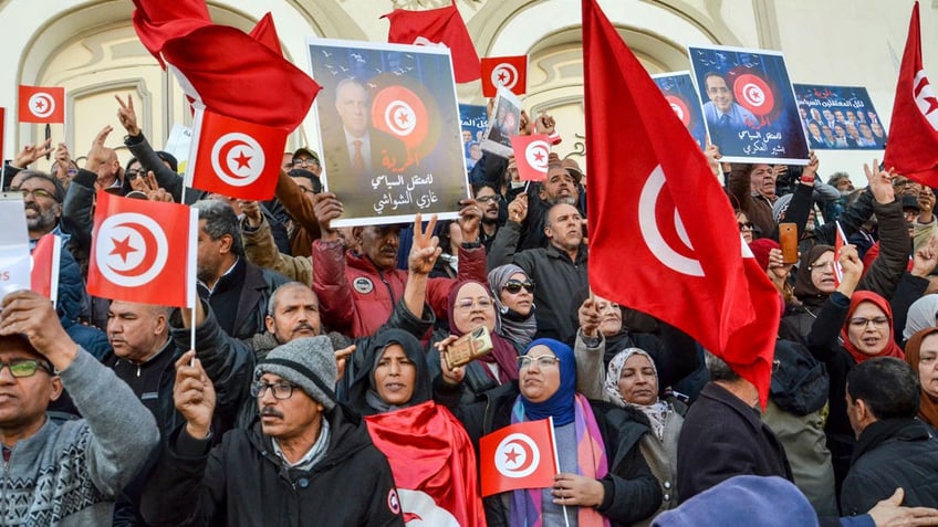 People take part in a protest against president Kais Saied policies, in Tunis, Tunisia