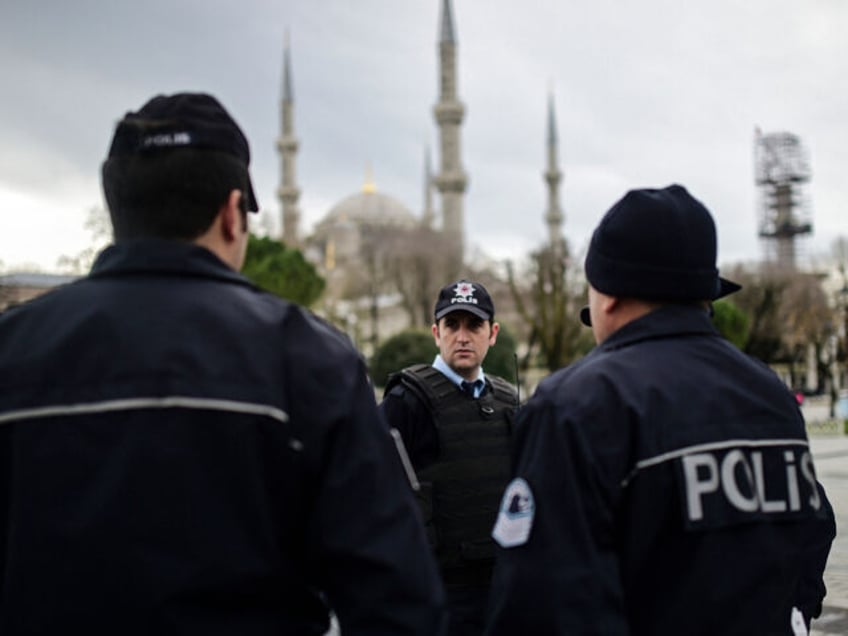 TOPSHOT - Turkish police officers stand guard near the Blue Mosque in Istanbul's tourist hub of Sultanahmet on January 13, 2016, a day after an attack. Turkish authorities probed how a jihadist from Syria killed 10 mainly German tourists in an attack in the heart of Istanbul that raised alarm …