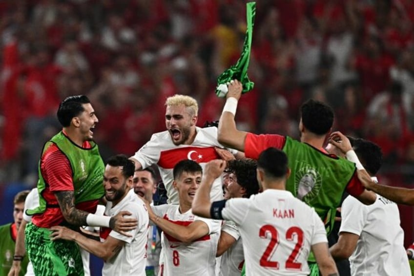 A goal in time added on secured Turkey a 2-1 win over 10-man Czech Republic and a place in