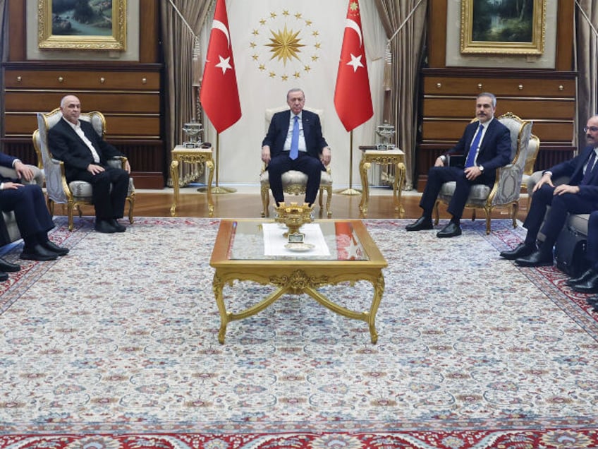 In this handout photo released by Turkish Presidency, Turkish President Recep Tayyip Erdog