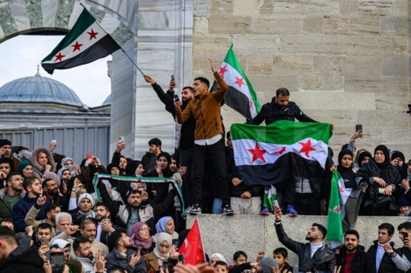 Syrians in Istanbul celebrate the reported fall of the Assad regime