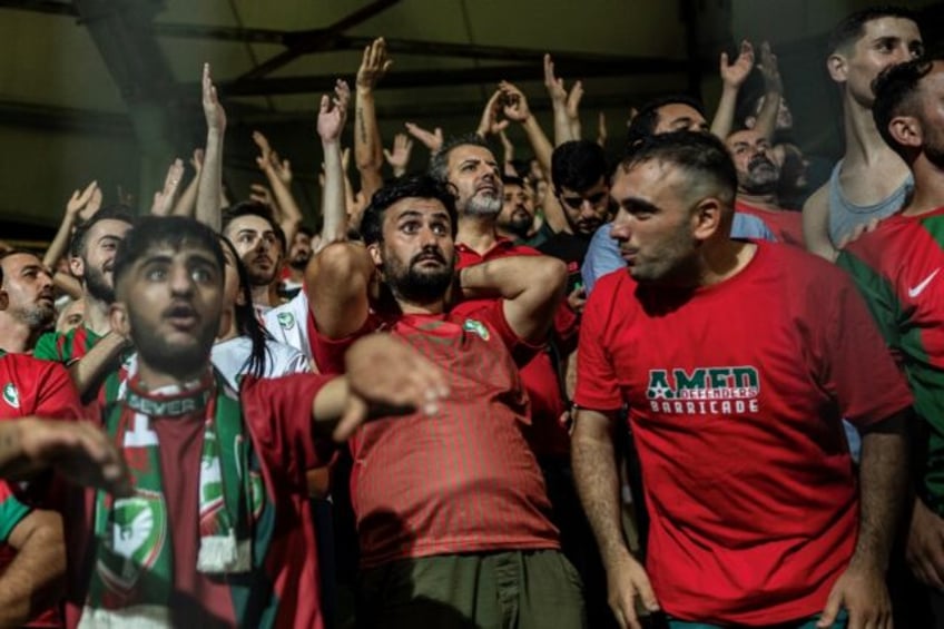 Amedspor's fans cheer in the stands during a league football match between Amedspor and Sa