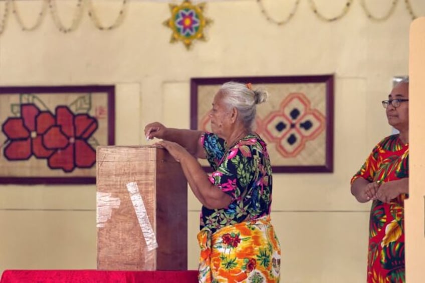 A woman votes at a polling station on election day in Funafuti, the capital of the south Pacific nation of Tuvalu