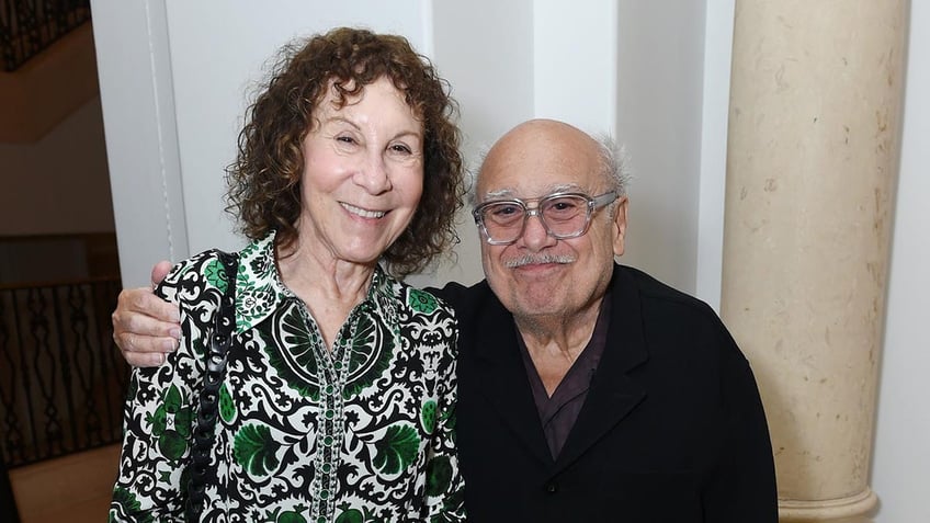 Danny DeVito smiling with Rhea Perlman