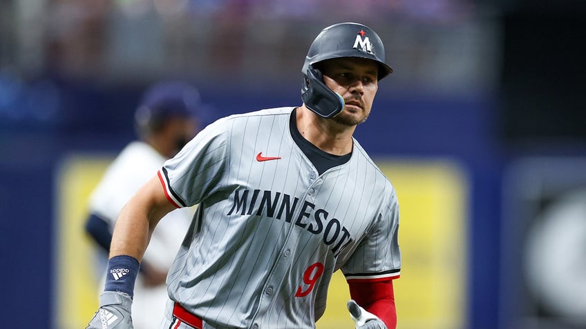 Trevor Larnach runs the bases